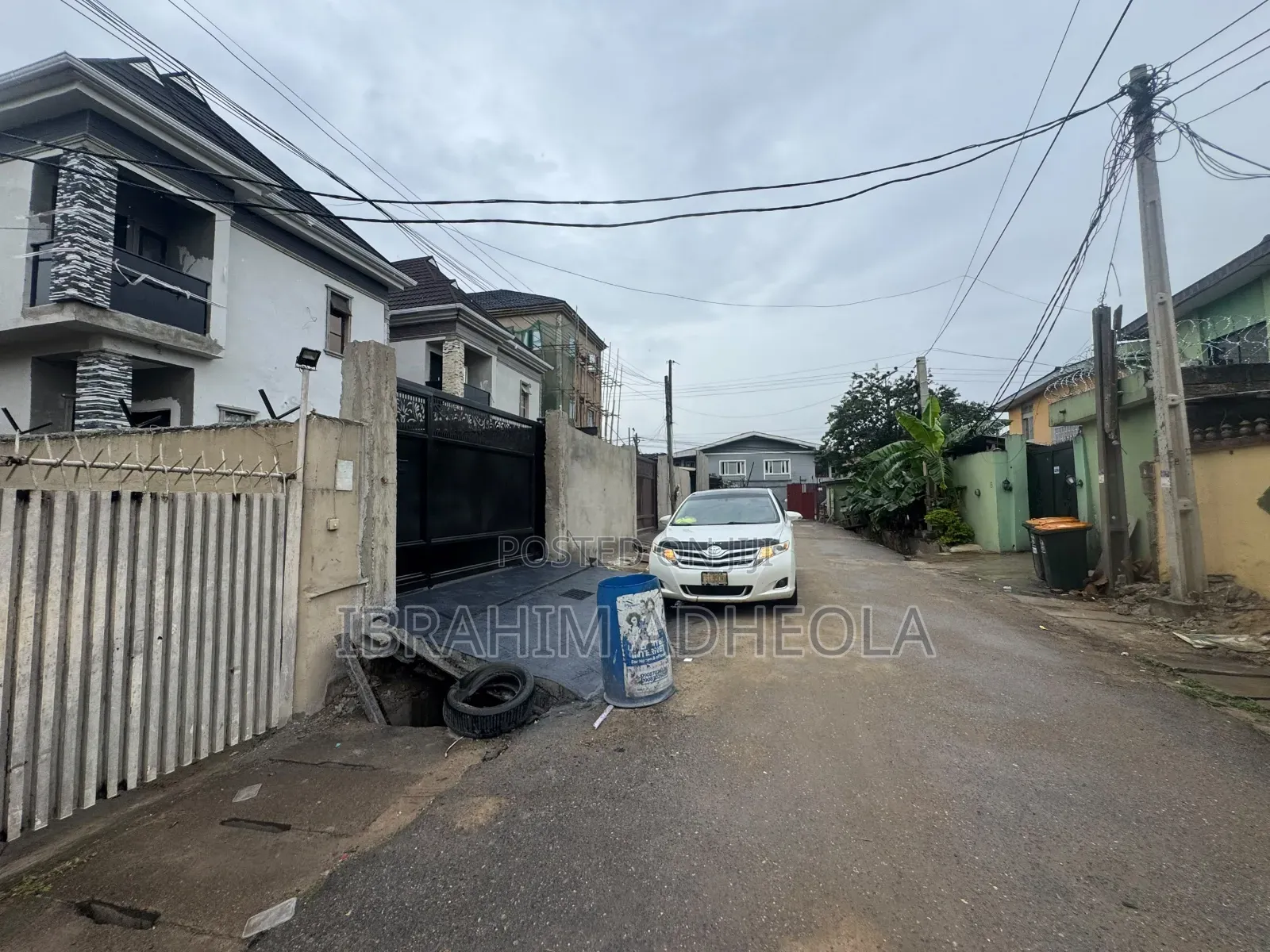 Land Measuring 400sqmh 2units of 2bedroom Flatsand a Bungalow At in Ilupeju Industrial Estate