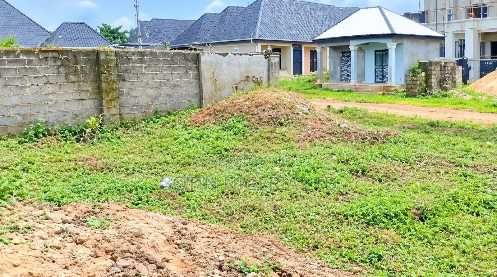 50ft × 100ft Plot of Land With Existing 4-Bedroom Bungalow Foundation in Benin City