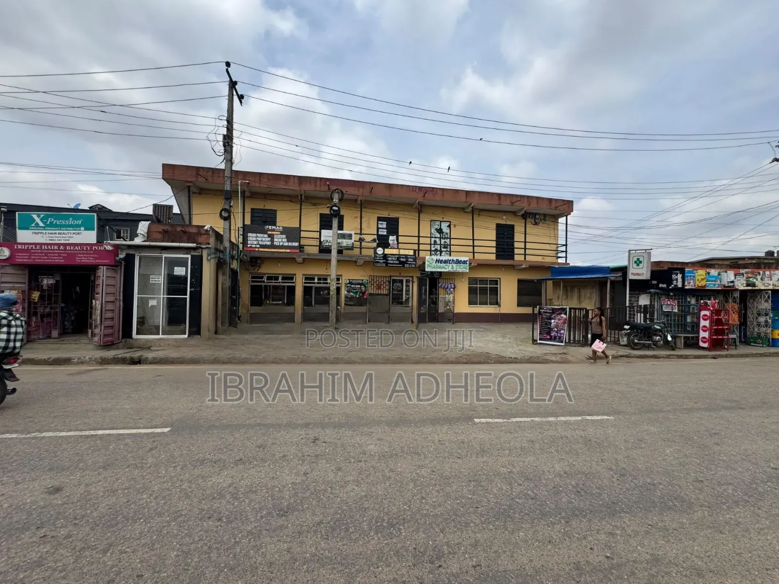 Land Measuring 380sqm With a Complex Which Consists of Various Shops in Ifako-Ogba